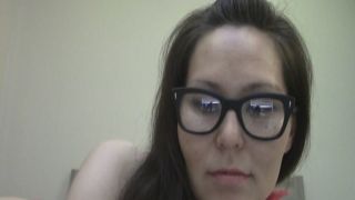 Nerdy woman masturbates in front of the webcam